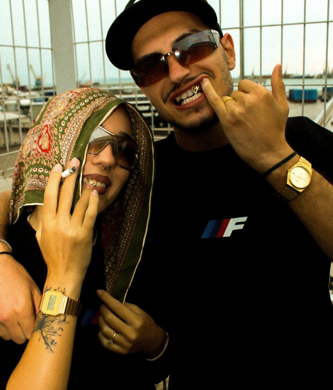 Two models posing together with Fluss Equipe box logo t-shirt